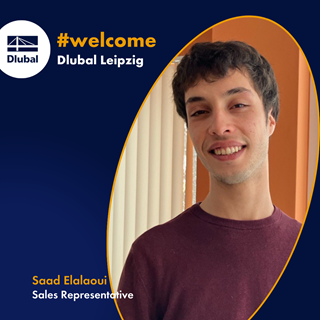 Saad Elalaoui, Sales Representative at Dlubal Software, standing in a modern office environment and smiling at the camera.