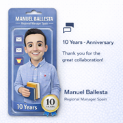 3D illustration of Manuel Ballesta depicted as an action-figure-style character inside a product package. He is smiling, holding books, and the design highlights a “10 Years Anniversary” badge, celebrating his role as Regional Manager Spain.