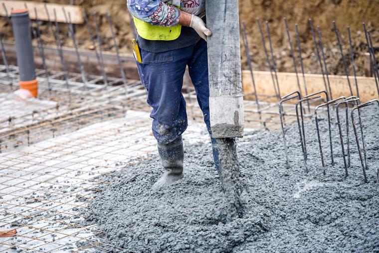 Applying Concrete at Construction Site
