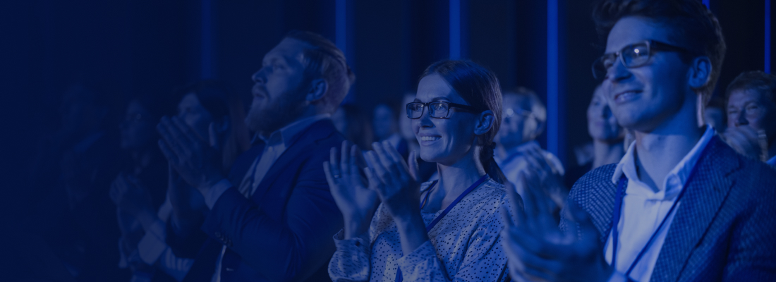 Attendees at a construction engineering conference with presentation displays and discussion panels.