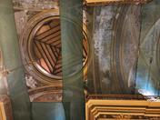 Dome and vault of the San Francisco Temple undergoing restoration, with protective mesh and deterioration in paint and structure