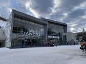 View of the modern 3S cable car station with skiers preparing for their run. Winter. Tourist season.