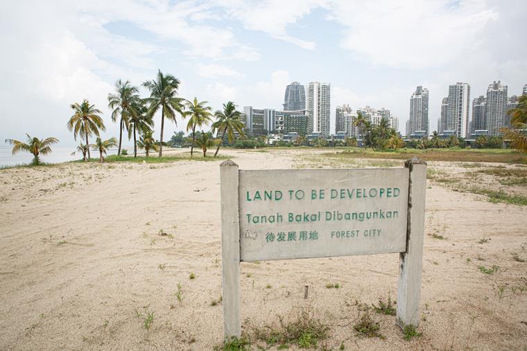 Artificial islands in Malaysia, with modern urban development and beach facilities