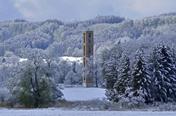 Bannwald tower in winter with snow-covered trees in background