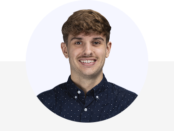 Alexander Bacon smiling against a backdrop, celebrating the 10th anniversary of the company's USA office.