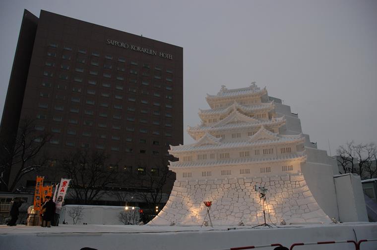 An impressive ice sculpture in the shape of a temple at a Japanese festival.