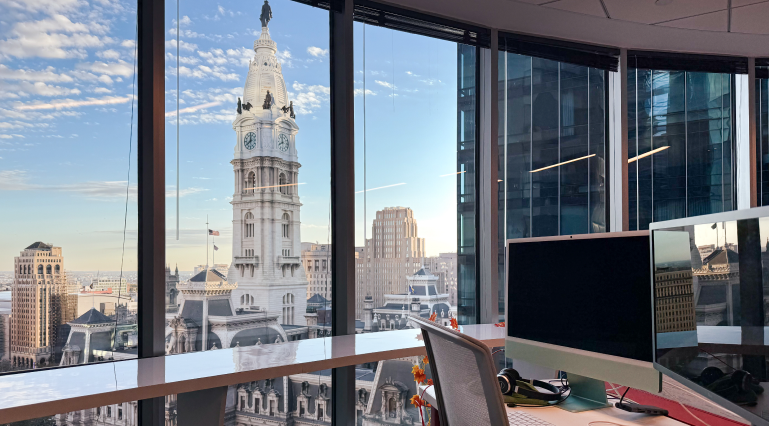 Office view overlooking Philadelphia City Hall capturing the urban landscape through the window.