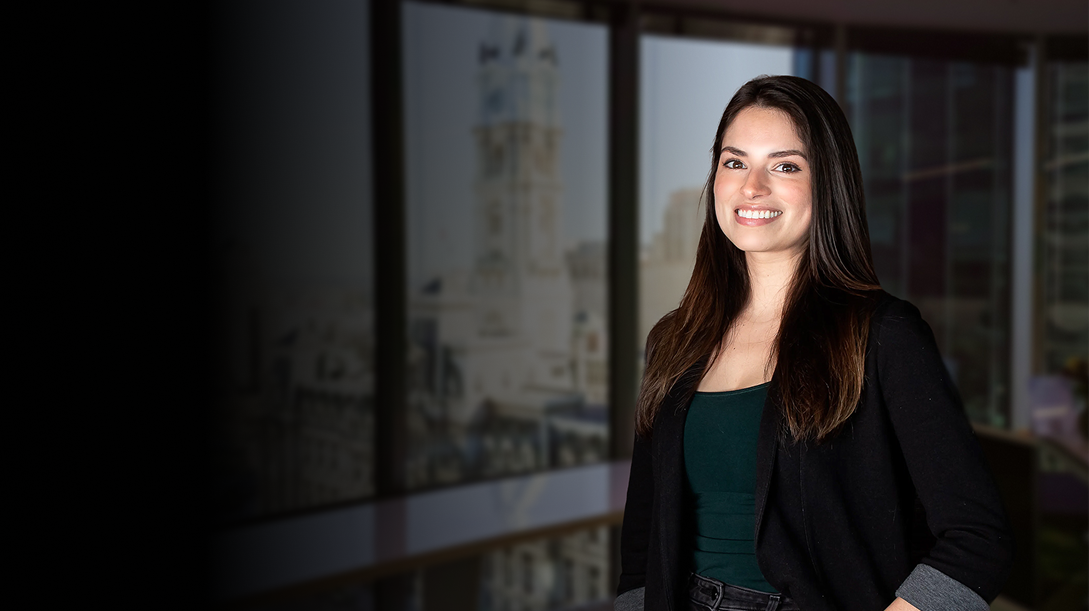 Ansley Varela smiling at the camera in the Philadelphia office, suitable for Careers page.