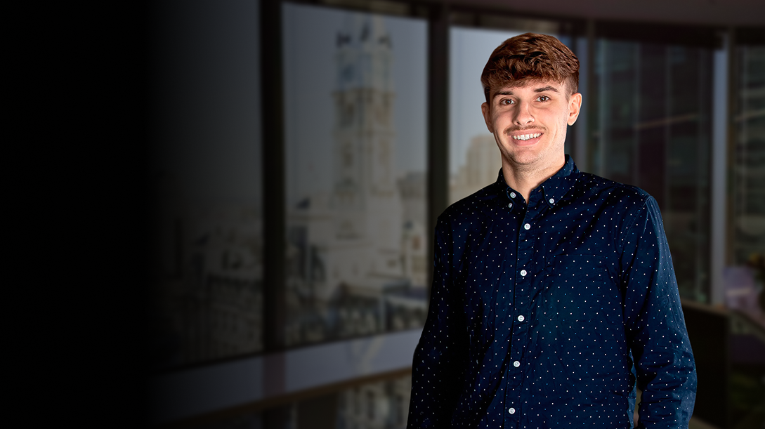 Photograph of our colleague Alex Bacon, EIT, in the Philadelphia office. The photo is for the Careers page and for the description of the Customer Support Engineer position.