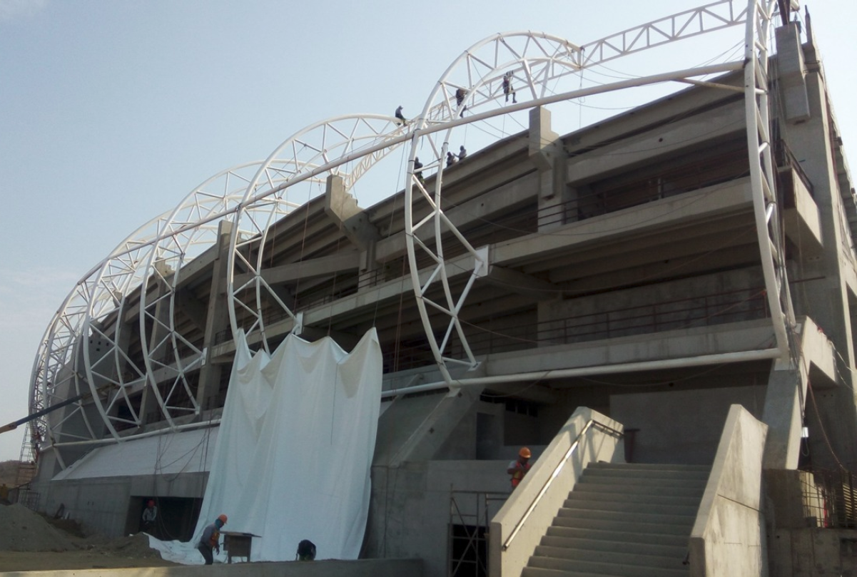 Exterior metal structure formed by curved lattices of different heights.