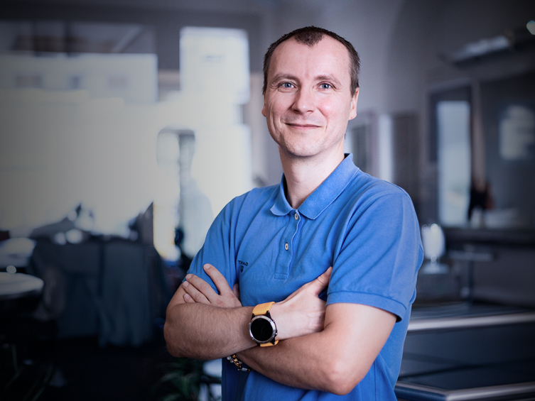 Portrait of employee Jaroslav Brož in a corporate office setting.