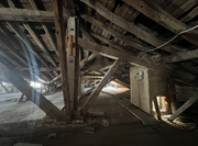 Dismantling of a timber truss in the roof structure.