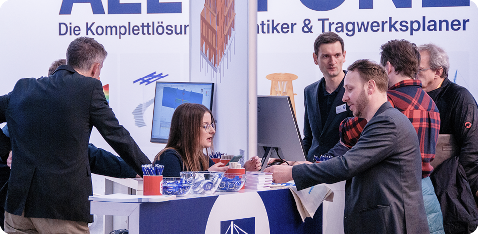 Dlubal Software booth at digitalBAU 2026 with smiling employees engaging with attendees.