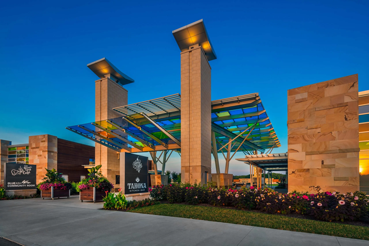 The Summit Park Pavilion shows a modern steel structure with elegant architecture.