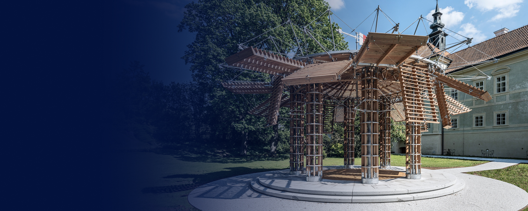 The elegant kinetic pavilion at Radíč Castle, designed by TIMBER DESIGN s.r.o., represents modern architecture and woodworking craftsmanship with an innovative design.