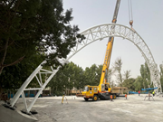 A steel truss girder is erected and installed at a location.
