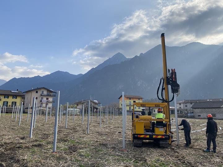 Photovoltaic systems are installed on a roof during the construction phase.