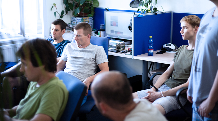 Software development team in a modern workspace | main banner