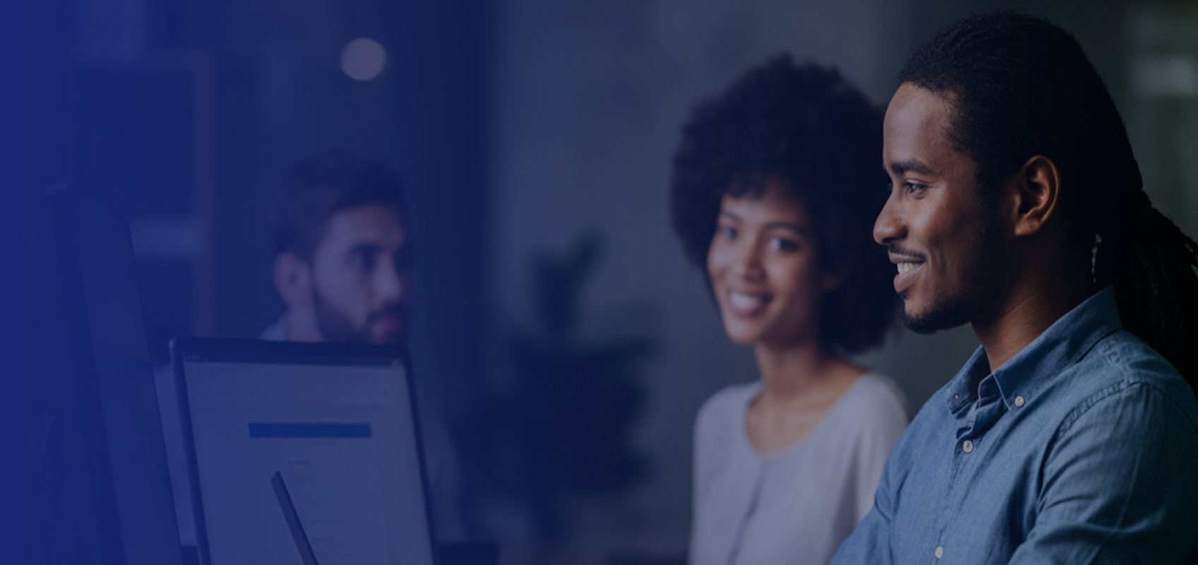 People engaged in a training session for learning the RFEM software at Dlubal facilities.