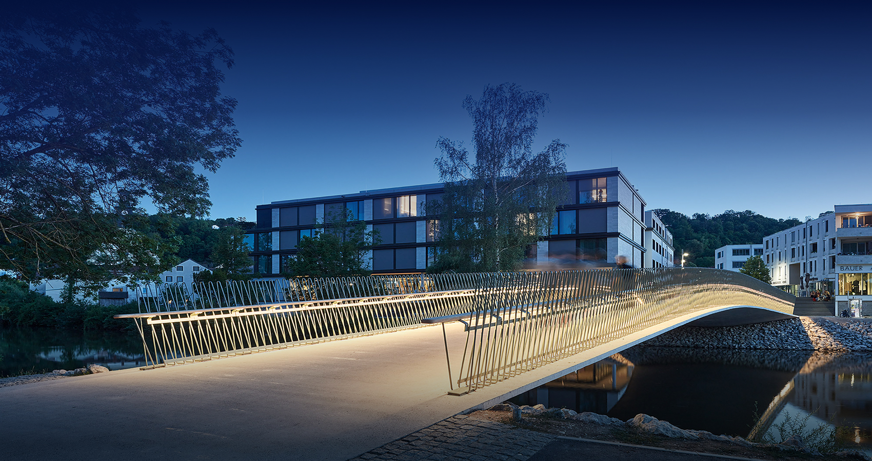 Bridge Structures | Herzogsteg bridge in Eichstätt, designed with curved reinforced concrete beams, ensuring durability and flood resilience.