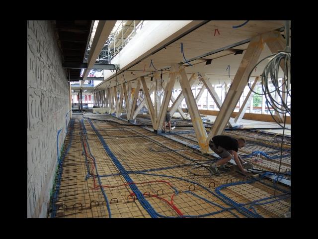 Travature dal pavimento al soffitto con diagonali in acciaio integrate in solette composte legno-calcestruzzo (© Indermühle Bauingenieure)