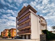 Edifício de madeira laminada cruzada de seis andares em Modena, Itália, dimensionado pela Ergodomus